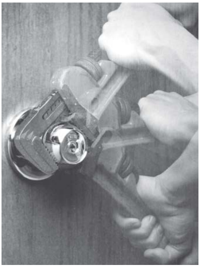 Image of an 8K knob with a wrench being used to illustrate the breakaway feature. 